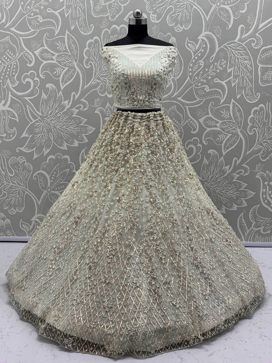 Dazzling Beige Zari Work Net Evening Wear Lehenga Choli With Dupatta