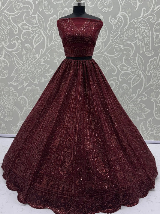 Stellar Maroon Thread Work Net Bridal Lehenga Choli With Dupatta