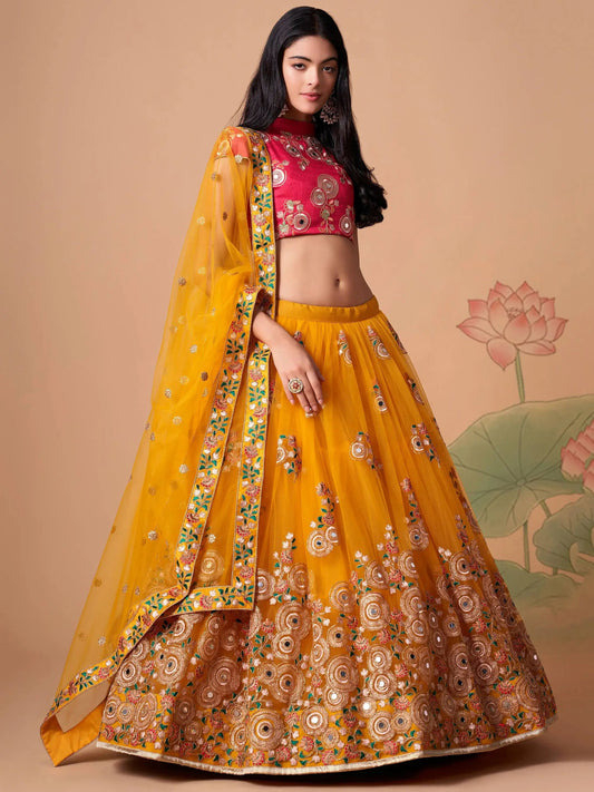 Impressive Yellow Mirror Work Net Reception Wear Lehenga Choli - Zeel Clothing