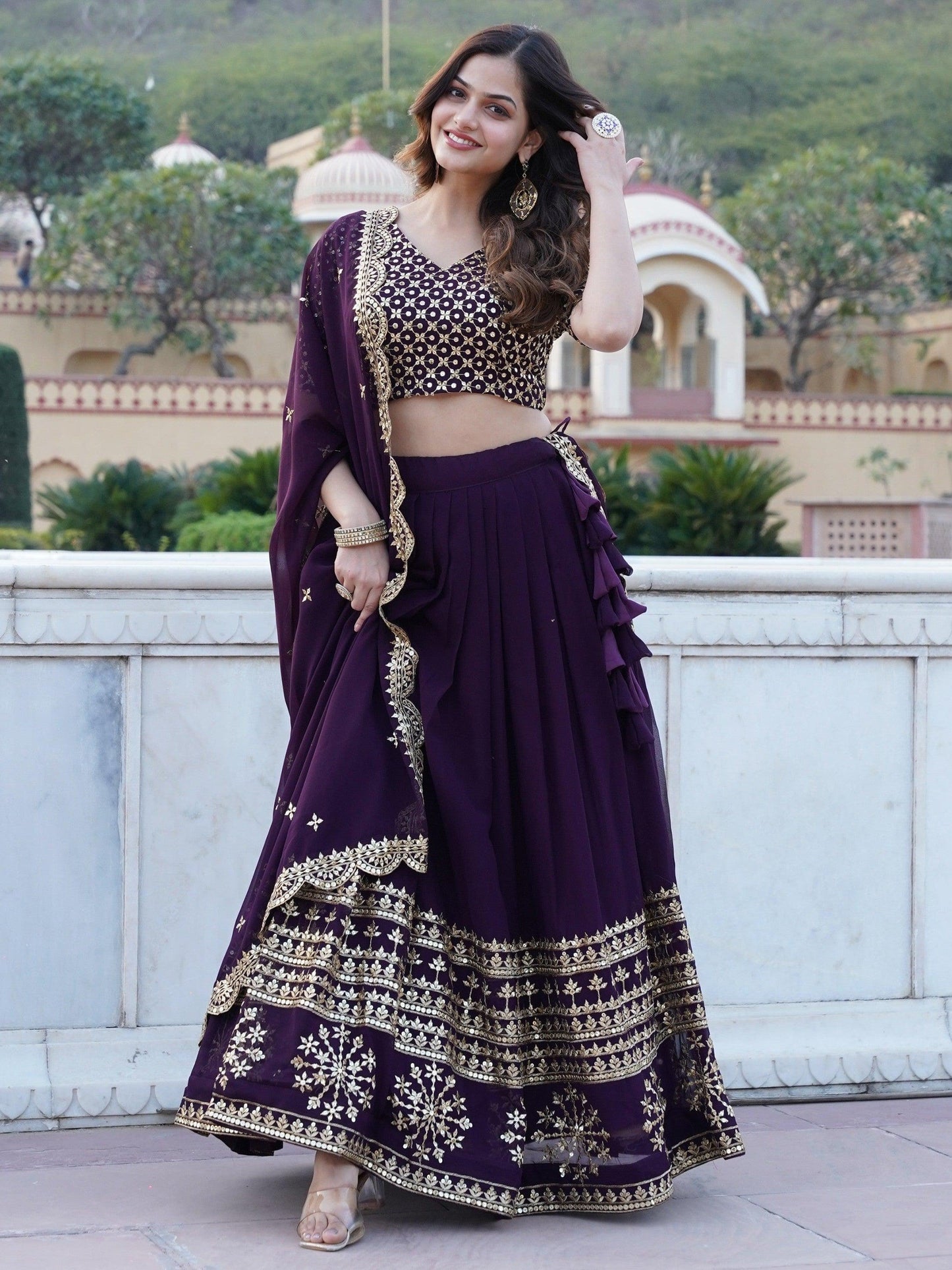 Surprising Purple Sequins Georgette Wedding Wear Lehenga Choli