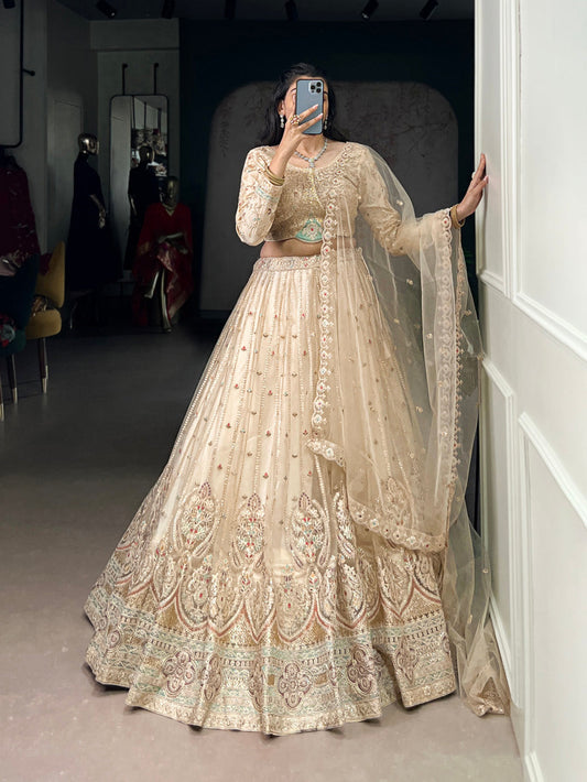 Cream Color Sequins And Thread Embroidery Work Net Lehenga Choli