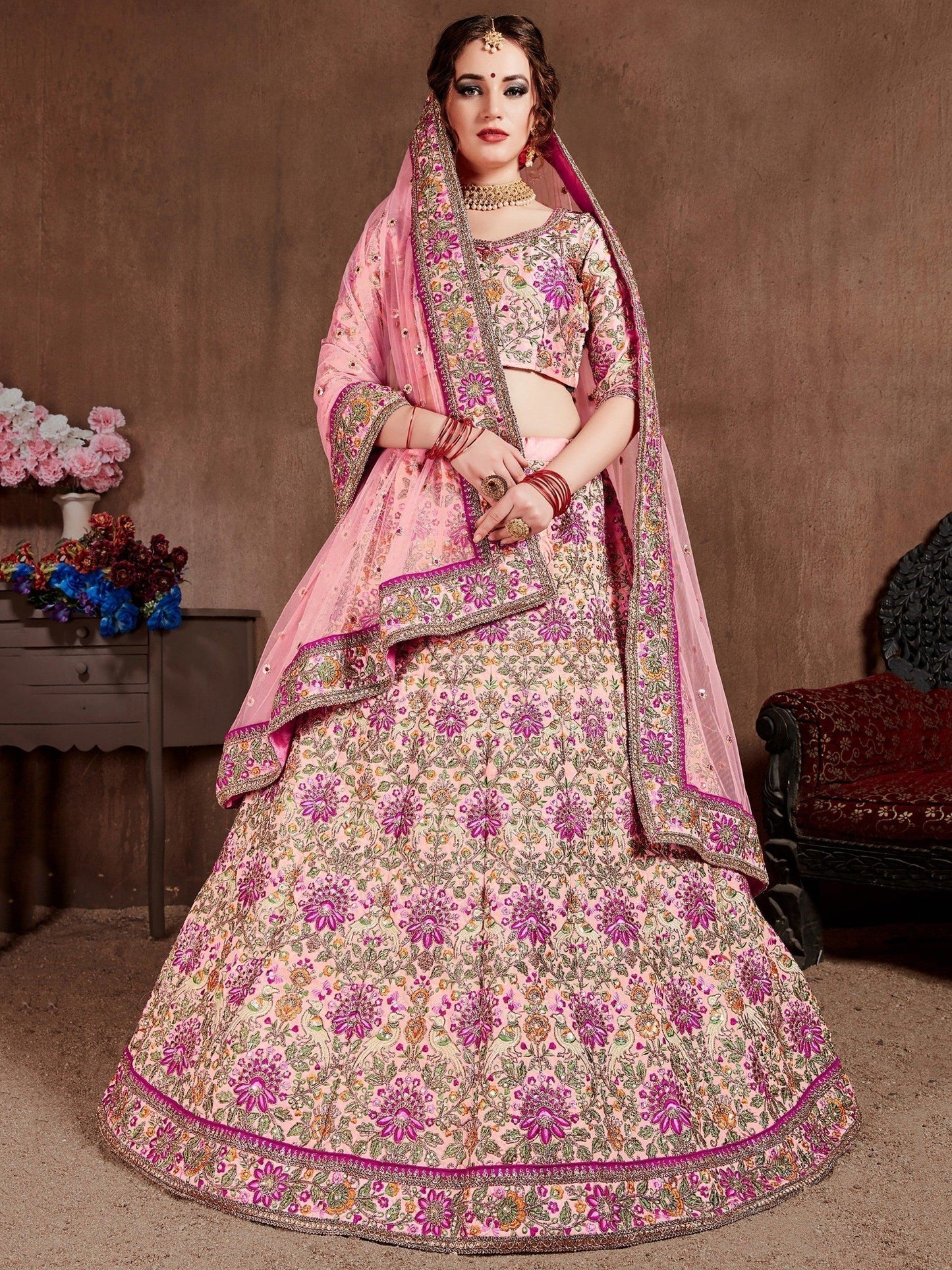 Prominent peach Colored Bridal wear Embroidered Lehenga Choli