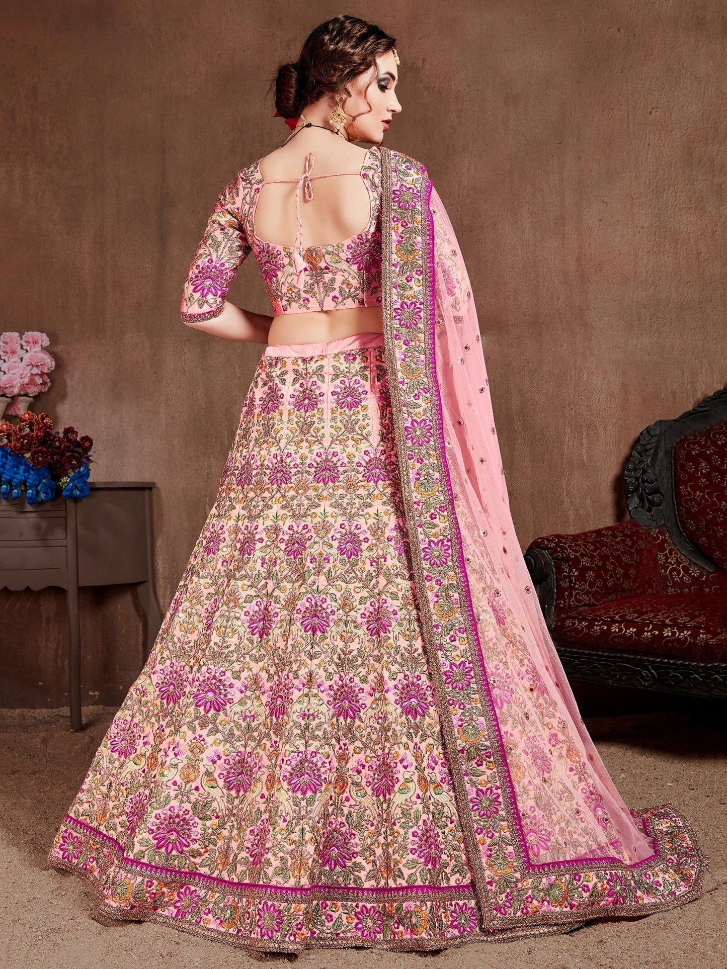 Prominent peach Colored Bridal wear Embroidered Lehenga Choli