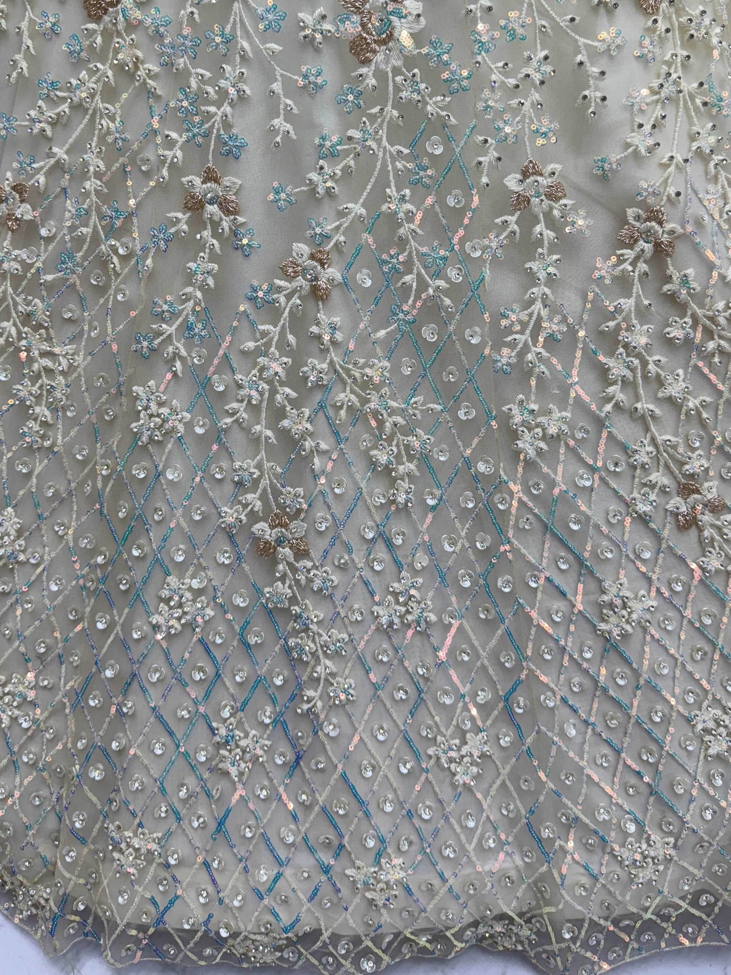 Dazzling Beige Zari Work Net Evening Wear Lehenga Choli With Dupatta