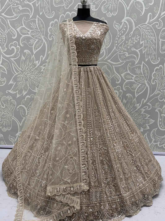 Enchanting Beige Embroidered Net Wedding Wear Lehenga Choli With Dupatta