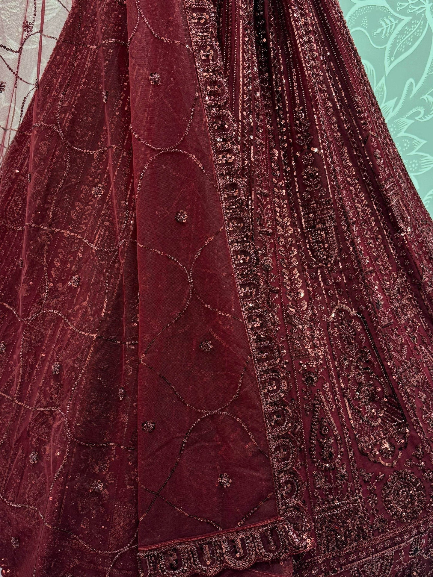 Stellar Maroon Thread Work Net Bridal Lehenga Choli With Dupatta