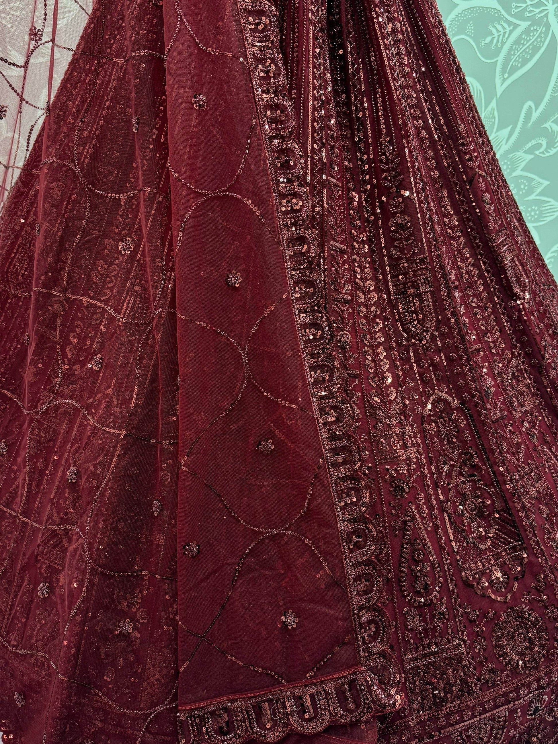 Stellar Maroon Thread Work Net Bridal Lehenga Choli With Dupatta