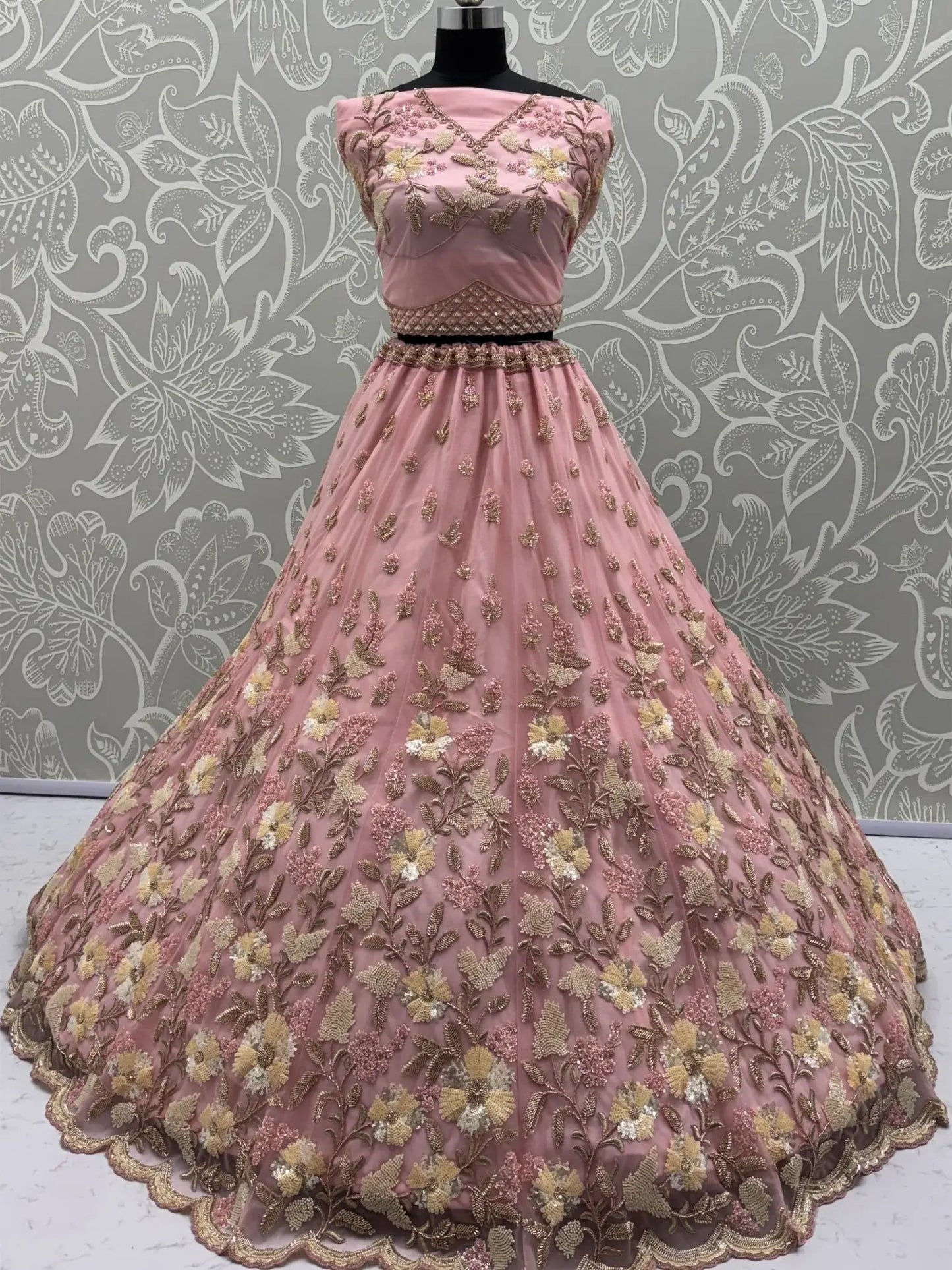 Stupendous Pink Sequins Embroidered Net Engagement Wear Lehenga Choli