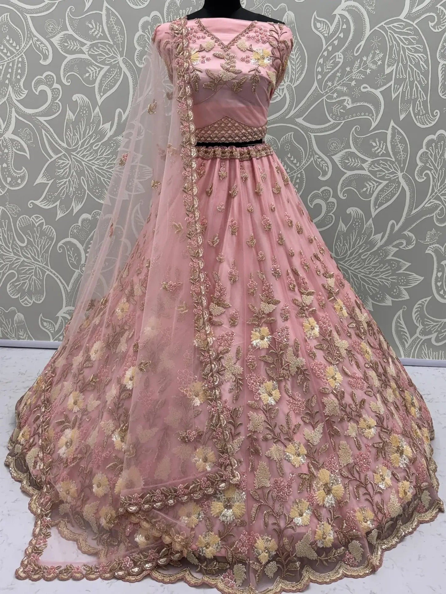 Stupendous Pink Sequins Embroidered Net Engagement Wear Lehenga Choli