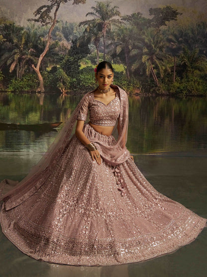 Gorgeous Mauve Sequins Net Reception Wear Lehenga Choli With Dupatta