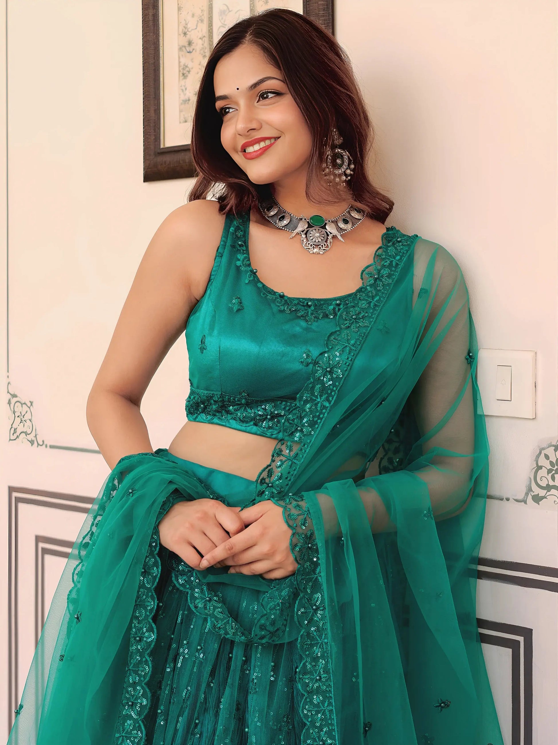 Delightful Teal Green Thread Embroidery Net Party Wear Lehenga Choli