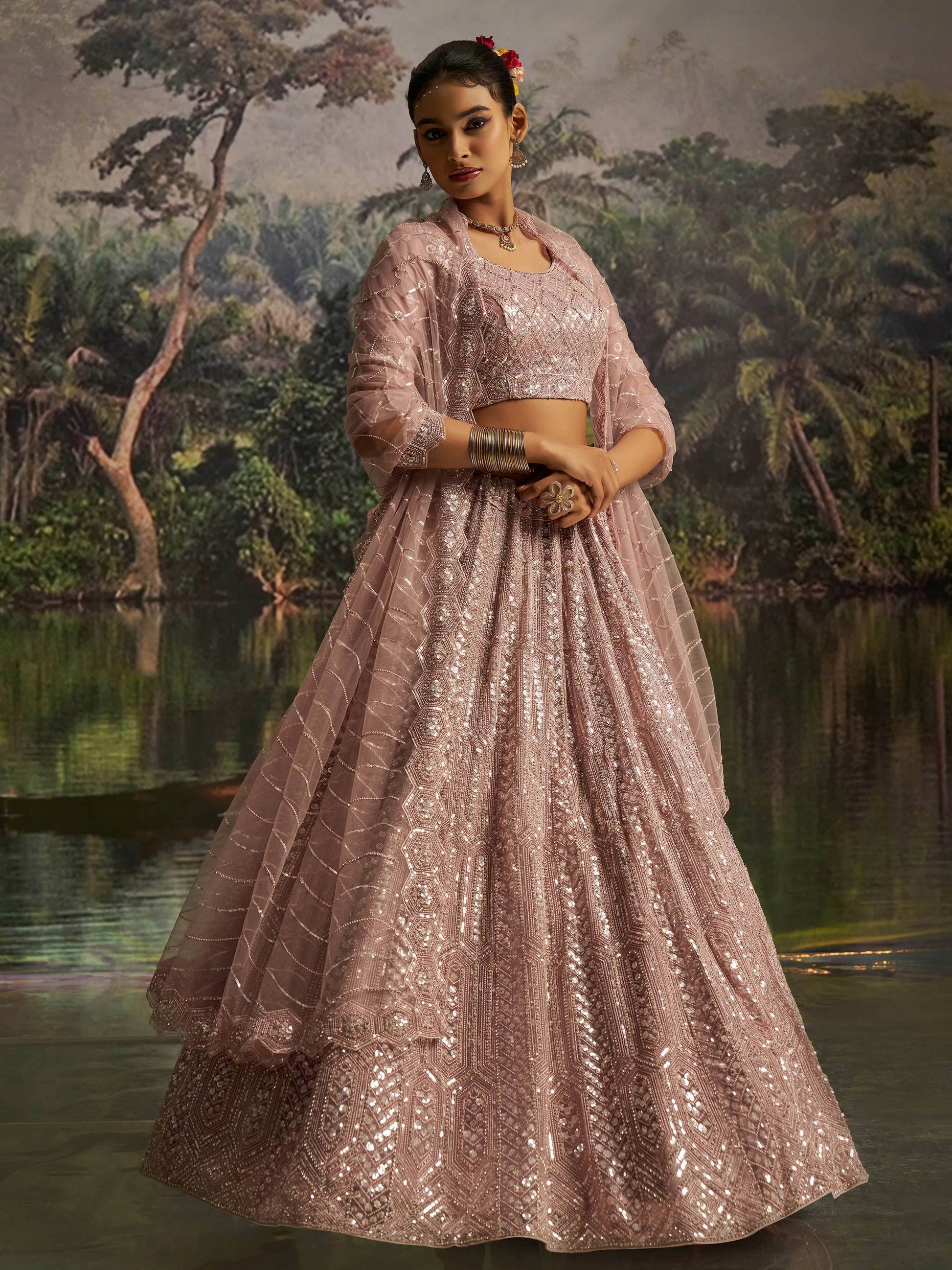 Dazzling Mauve Heavy Embroidered Net Event Wear Lehenga With Blouse