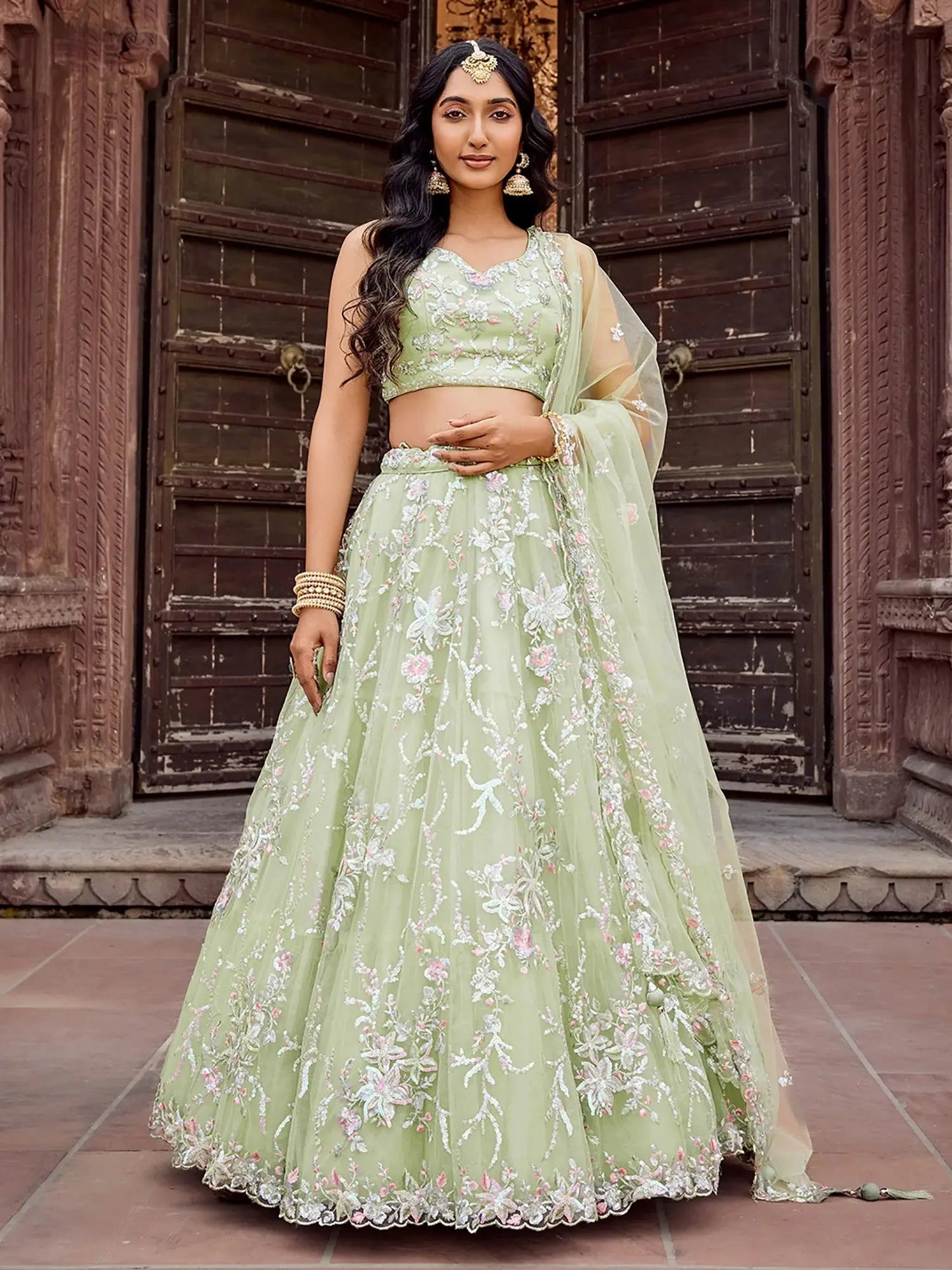 Pretty Pista Green Sequins Embroidery Net Mehendi Wear Lehenga With Blouse