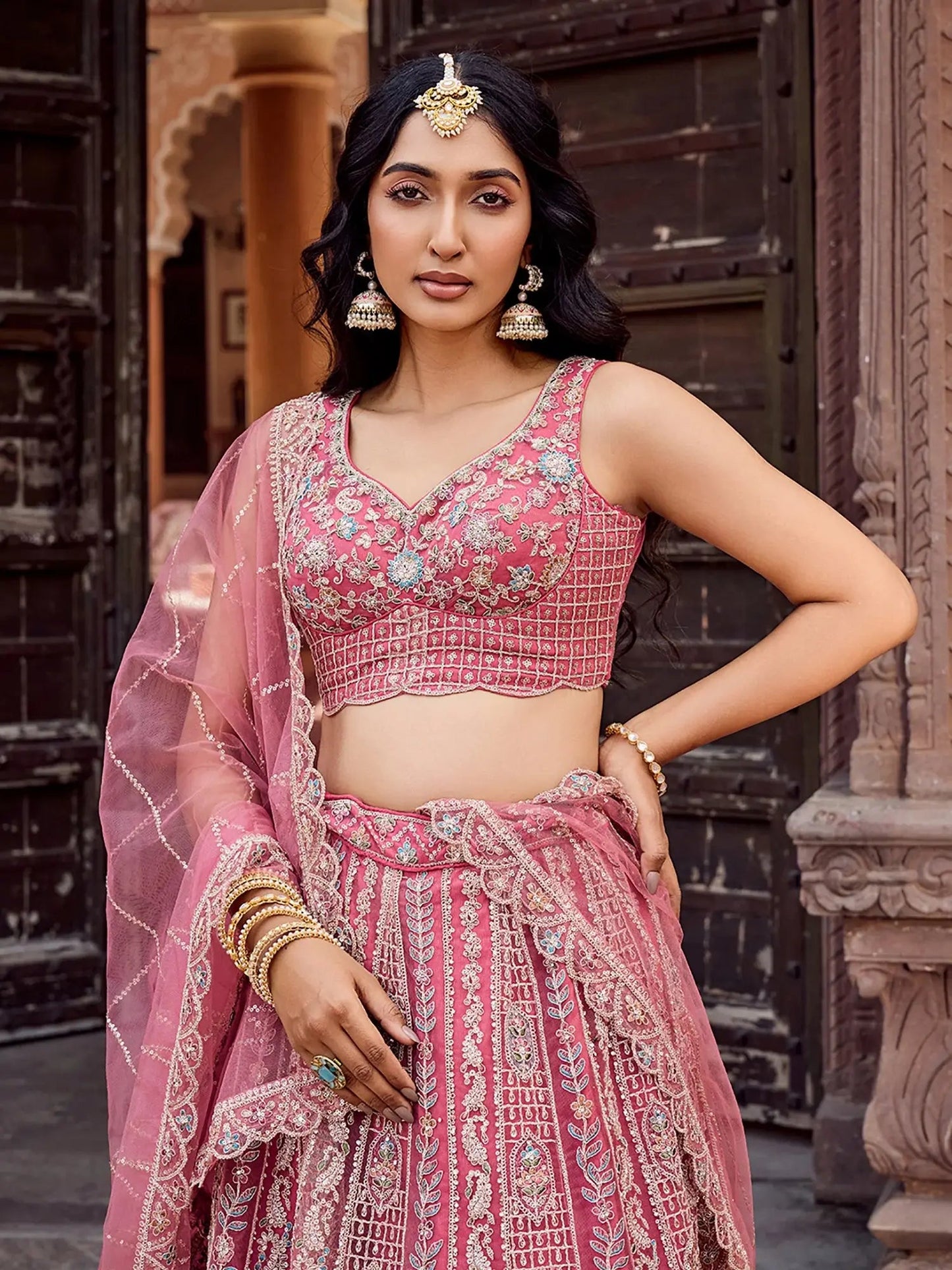 Regal Rose Gold Net Embroidered Engagement Wear Lehenga Choli With Dupatta
