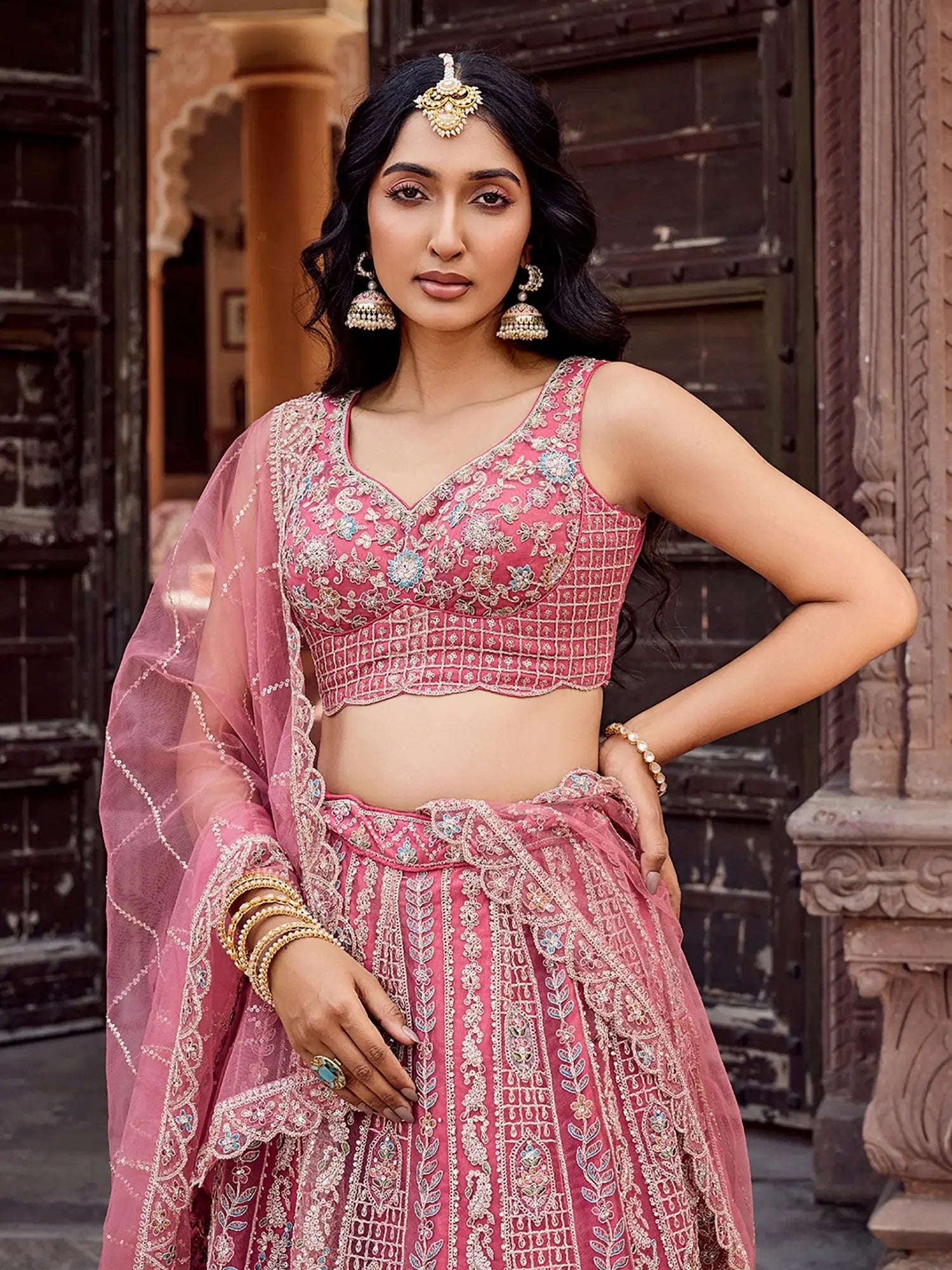 Regal Rose Gold Net Embroidered Engagement Wear Lehenga Choli With Dupatta