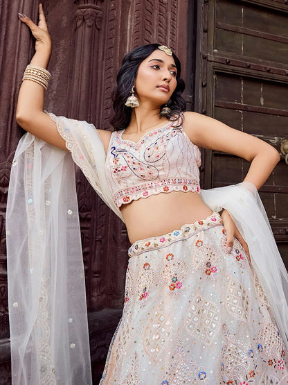 Gleaming Cream Embroidered Net Marraige Wear Lehenga Choli With Dupatta