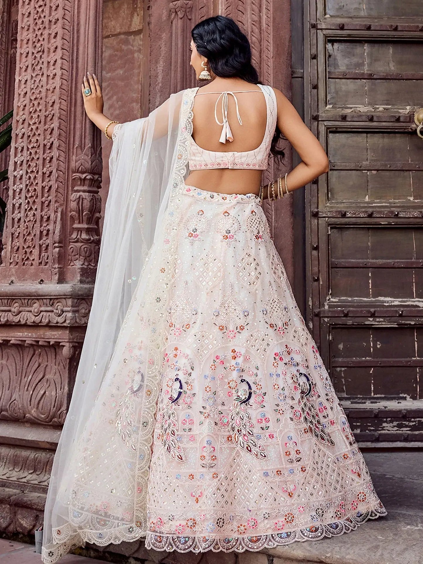 Gleaming Cream Embroidered Net Marraige Wear Lehenga Choli With Dupatta