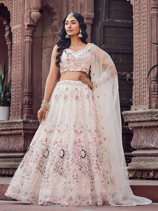 Gleaming Cream Embroidered Net Marraige Wear Lehenga Choli With Dupatta