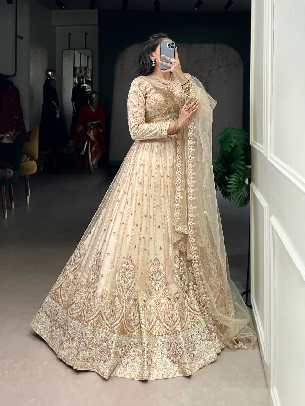 Cream Color Sequins And Thread Embroidery Work Net Lehenga Choli