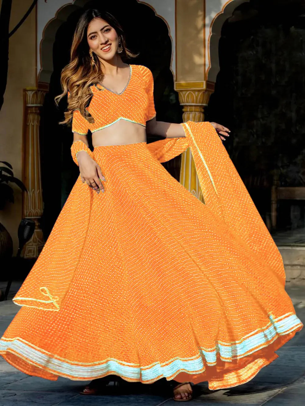 Enchanting Orange Laheriya Print Georgette Designer Lehenga Choli - Zeel Clothing