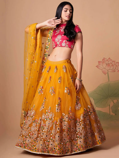 Impressive Yellow Mirror Work Net Reception Wear Lehenga Choli - Zeel Clothing