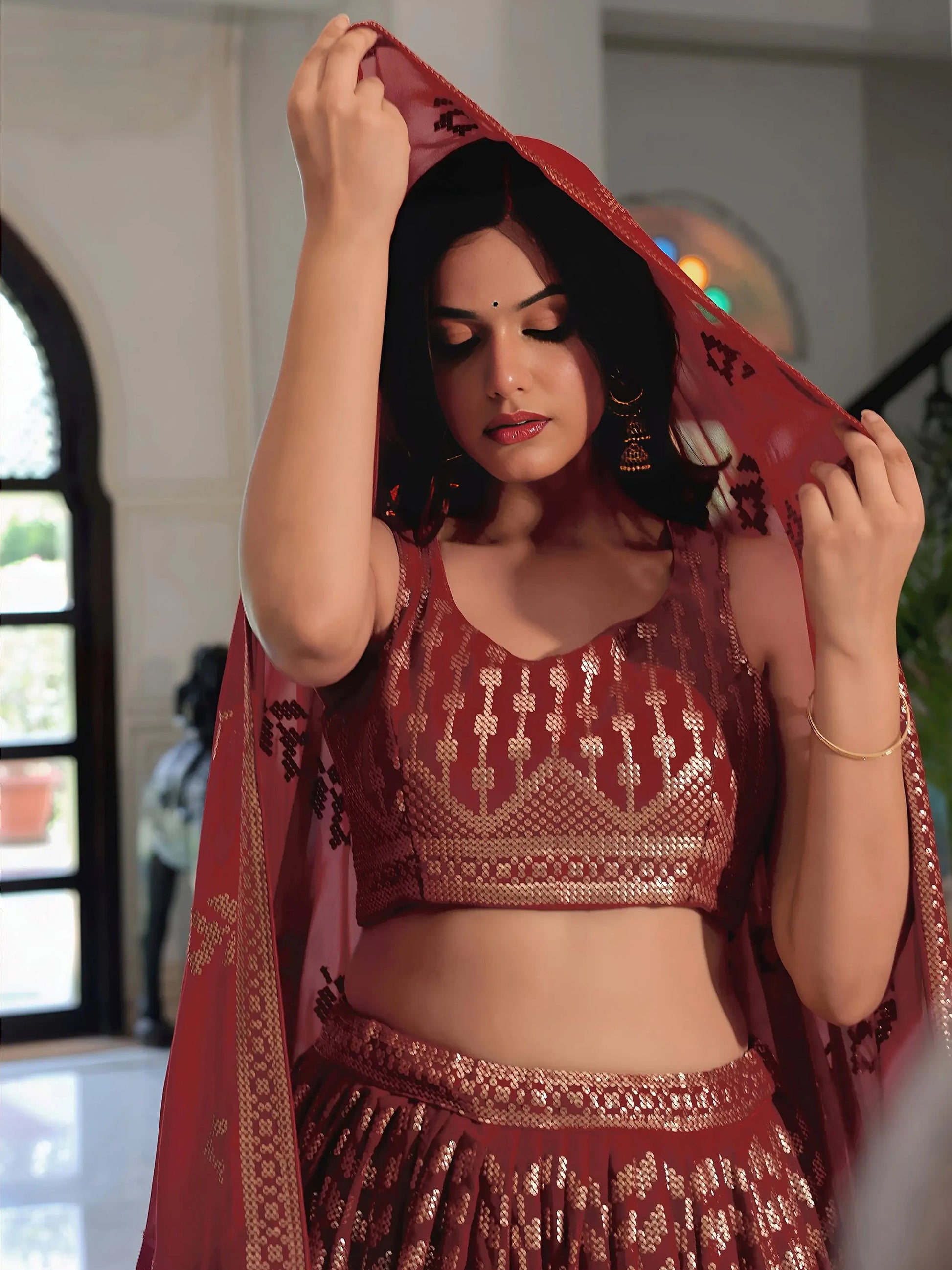 Noteworthy Maroon Sequins Georgette Reception Wear Lehenga Choli