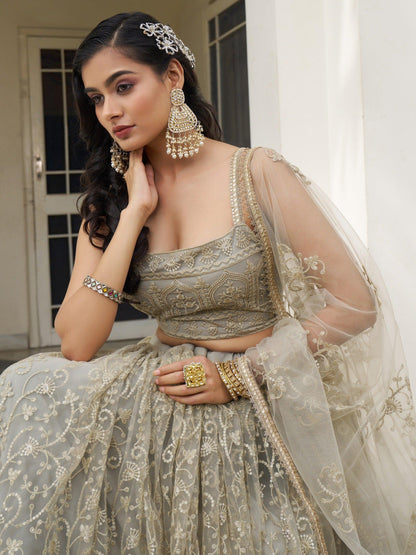 Bewitching Ivory Thread Work Net Engagement Wear Lehenga Choli