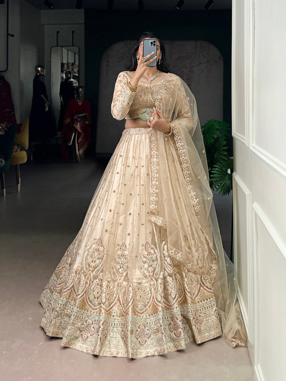 Cream Color Sequins And Thread Embroidery Work Net Lehenga Choli